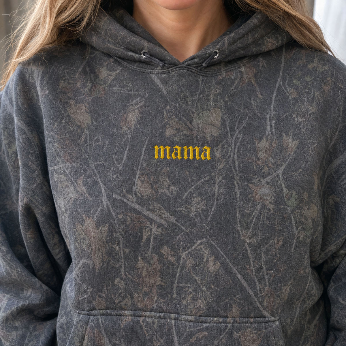 Model wearing the Mama heavyweight hoodie in Darkwood Tree Camo, lifestyle image 2