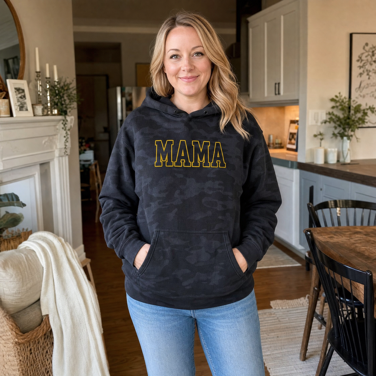 Model wearing the Mama Outline Text heavyweight hoodie in Black Camo, lifestyle image 1