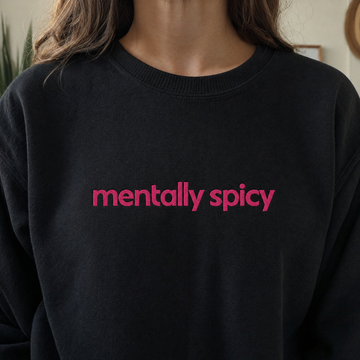 Model wearing the Mentally Spicy sweatshirt in Black, lifestyle image 1