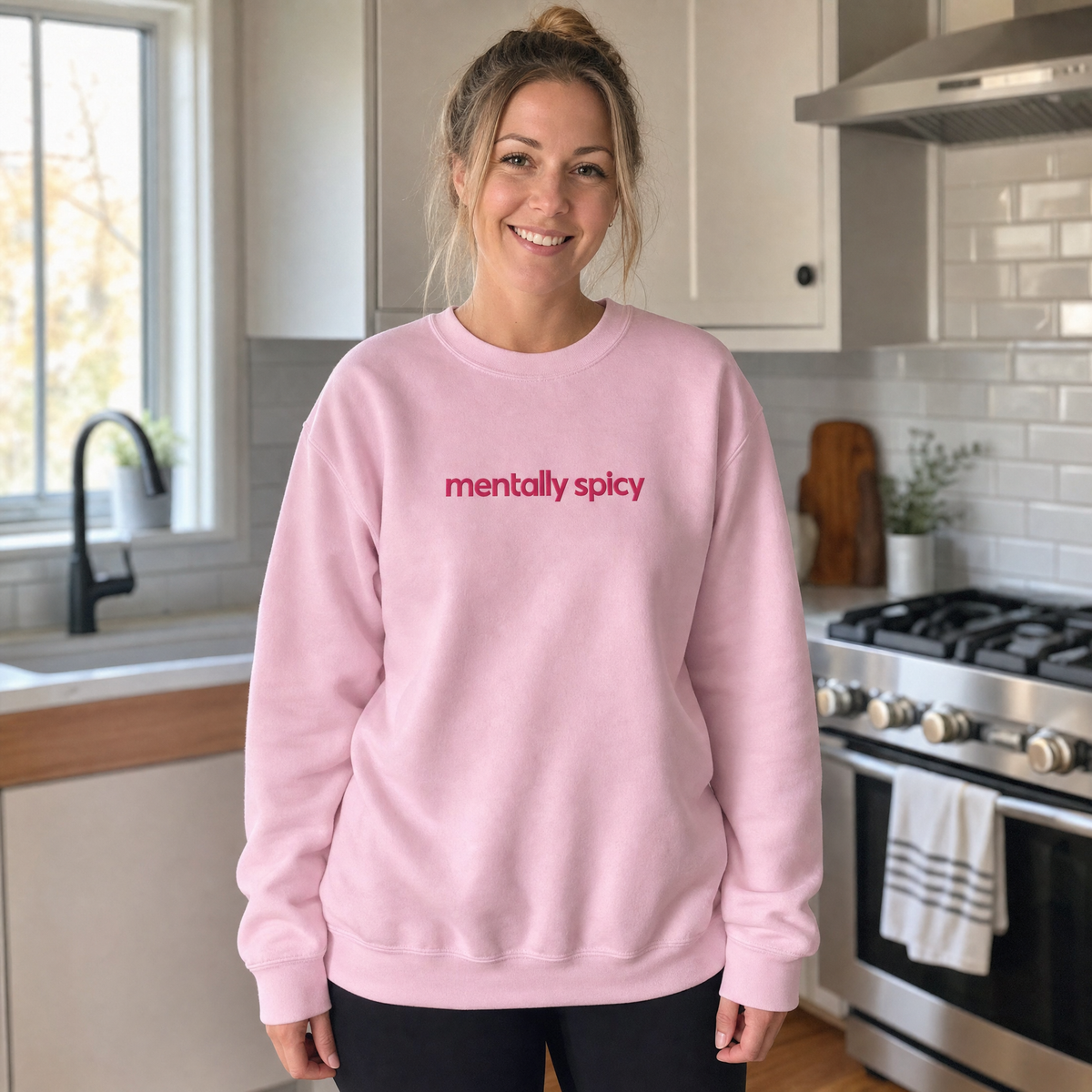 Model wearing the Mentally Spicy sweatshirt in Light Pink, lifestyle image 1