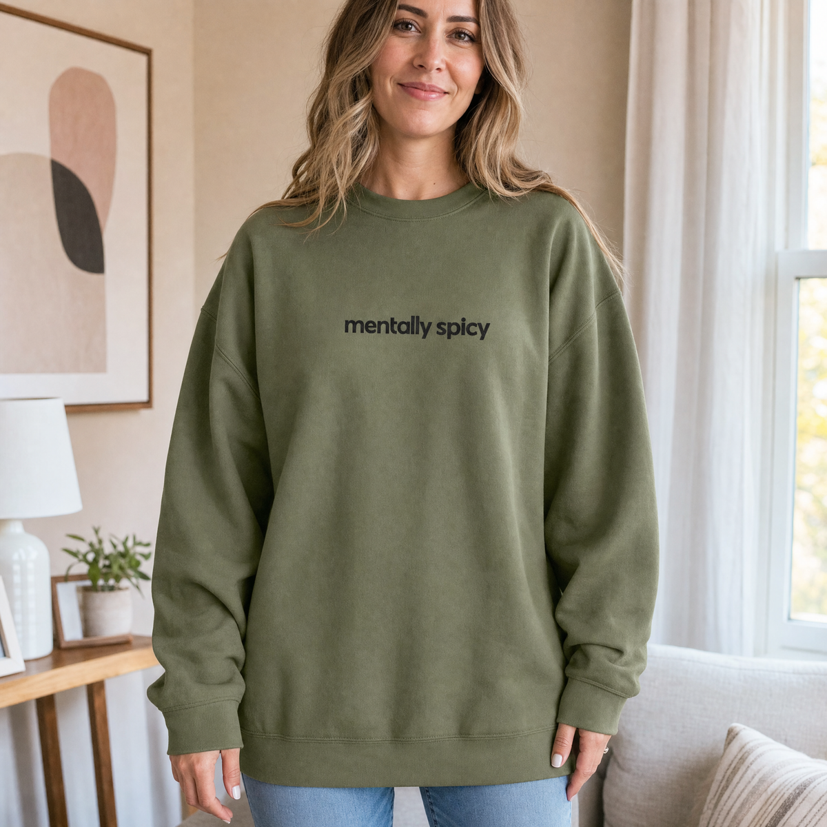 Model wearing the Mentally Spicy sweatshirt in Military Green, lifestyle image 1