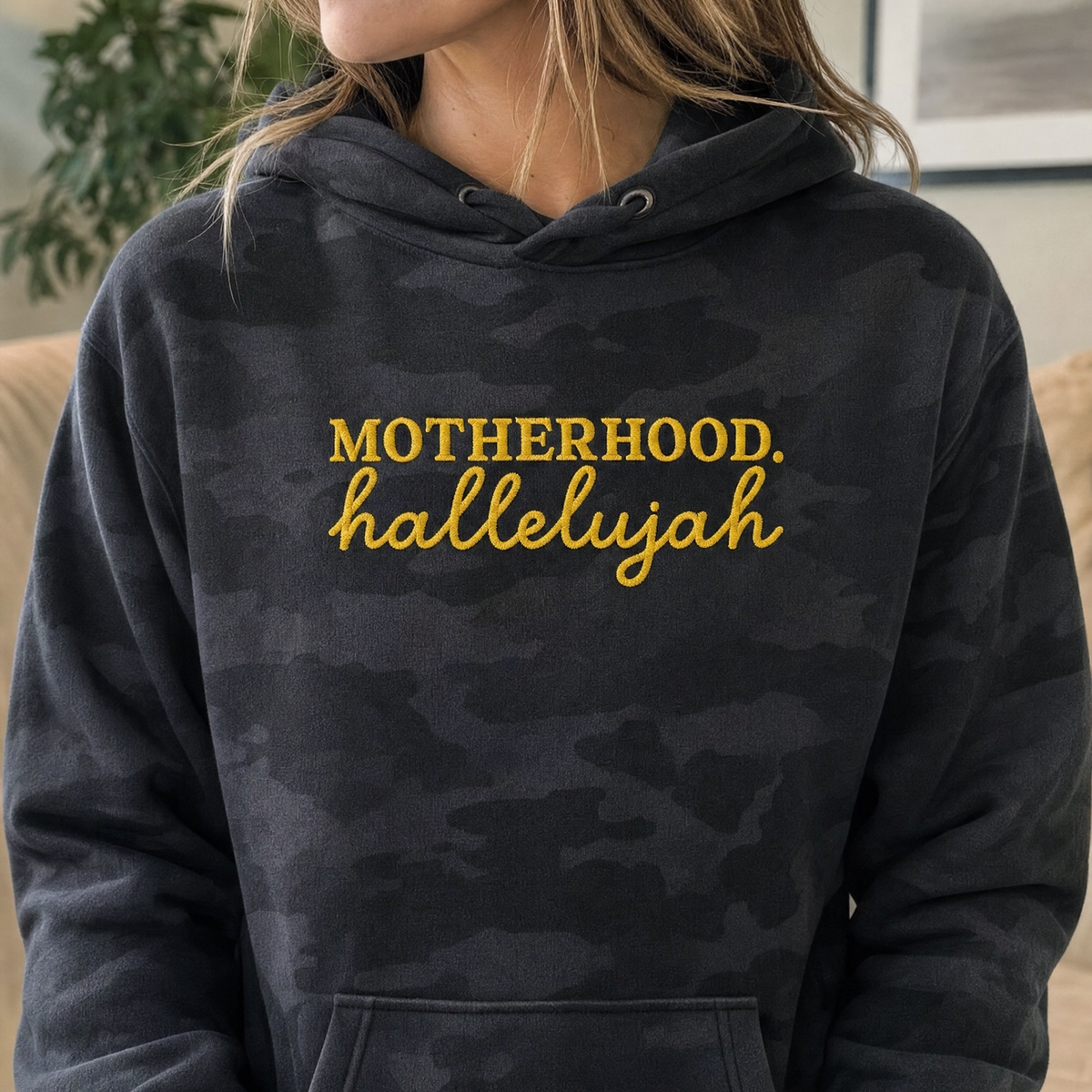 Model wearing the Motherhood Hallelujah heavyweight hoodie in Black Camo, lifestyle image 2