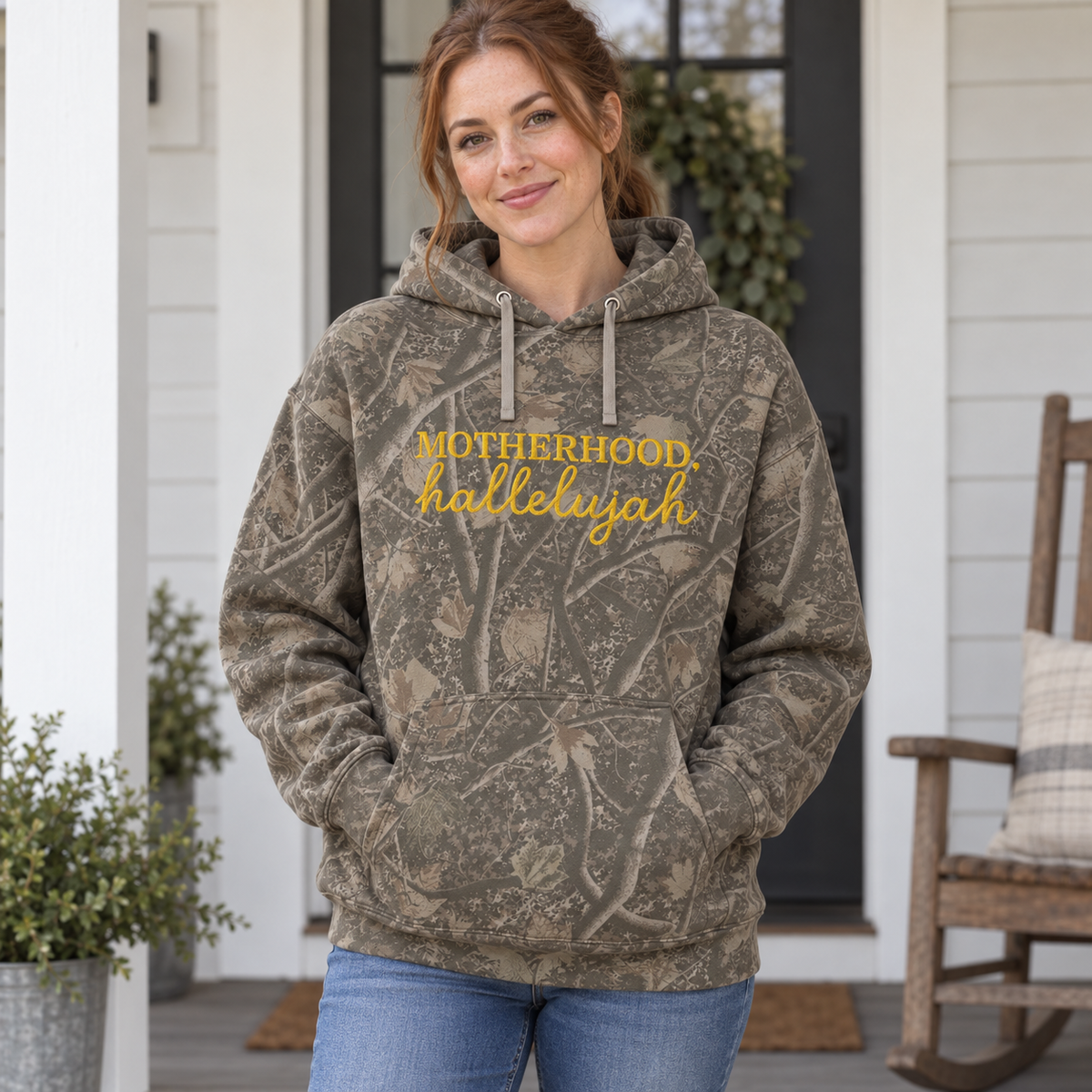 Model wearing the Motherhood Hallelujah heavyweight hoodie in Light Tree Camo, lifestyle image 1