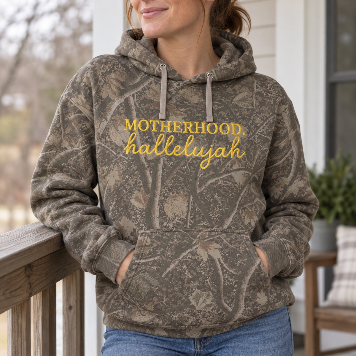 Model wearing the Motherhood Hallelujah heavyweight hoodie in Light Tree Camo, lifestyle image 2
