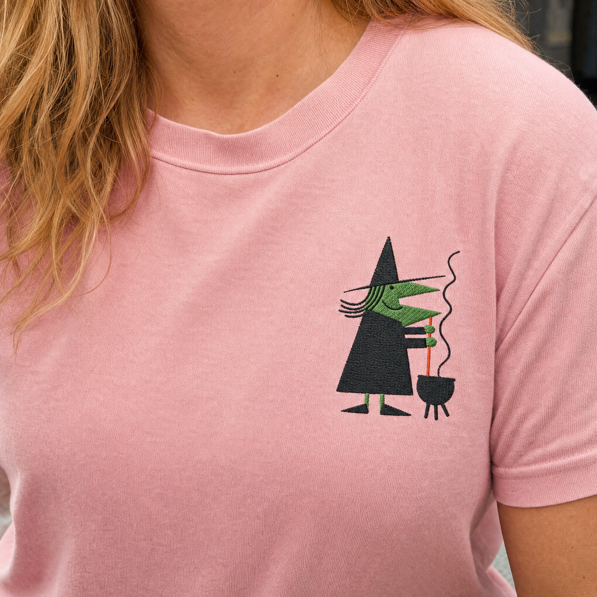 Model wearing the Retro Witch Stirring Cauldron comfort colors tee in Blossom, lifestyle image 2
