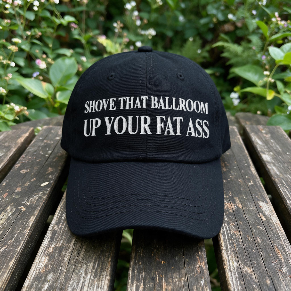 Shove That Ballroom Up Your Fat Ass embroidered hat in Black resting on a flat surface, lifestyle image 1