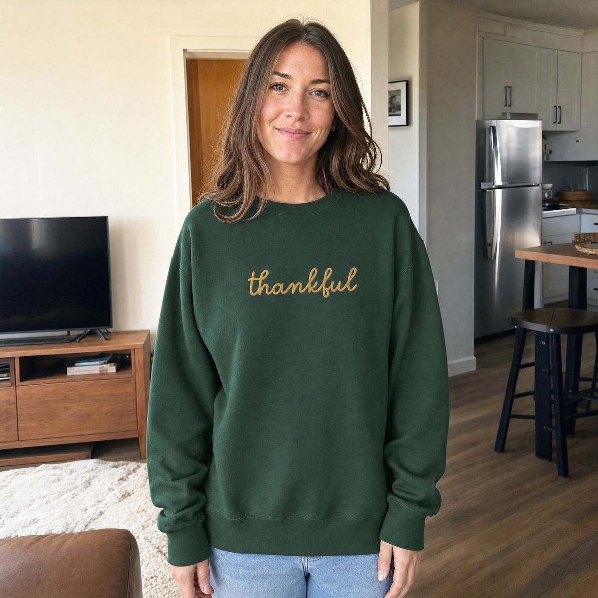 Model wearing the Thankful Script Sweatshirt sweatshirt in Forest Green, lifestyle image 1