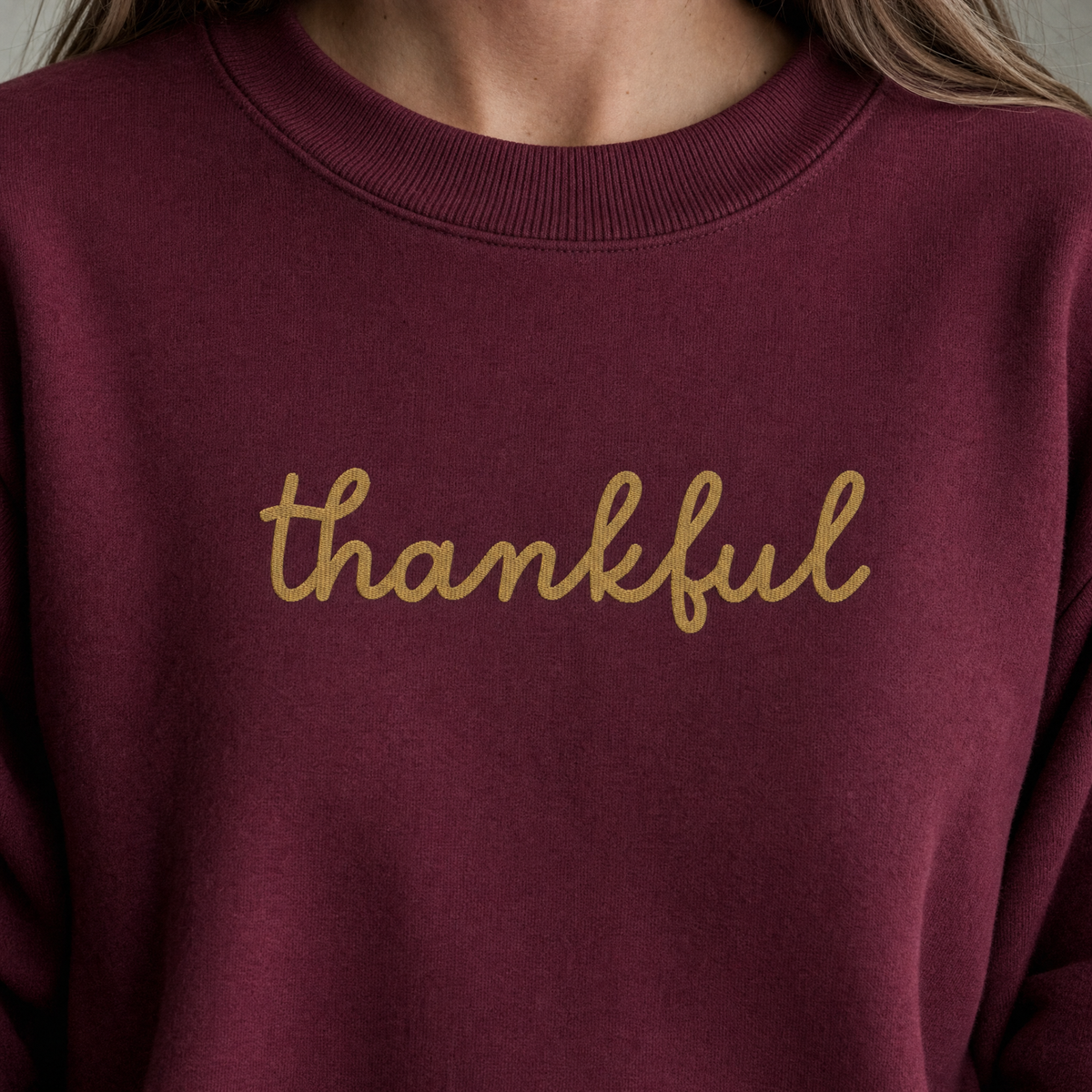Model wearing the Thankful Script Sweatshirt sweatshirt in Maroon, lifestyle image 2
