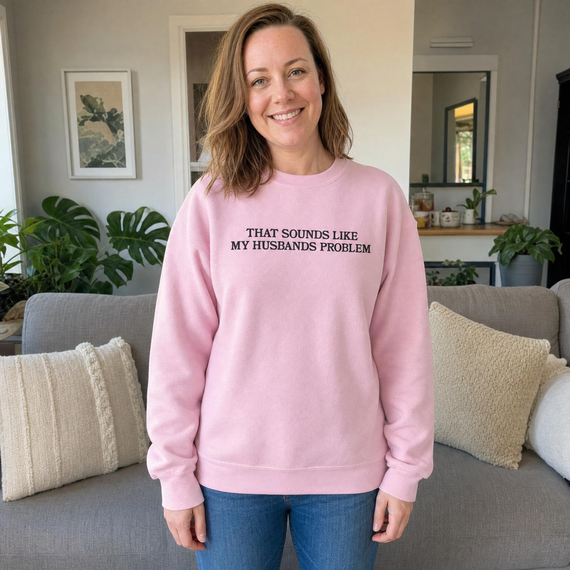 Model wearing the That Sounds Like My Husbands Problem sweatshirt in Light Pink, lifestyle image 1