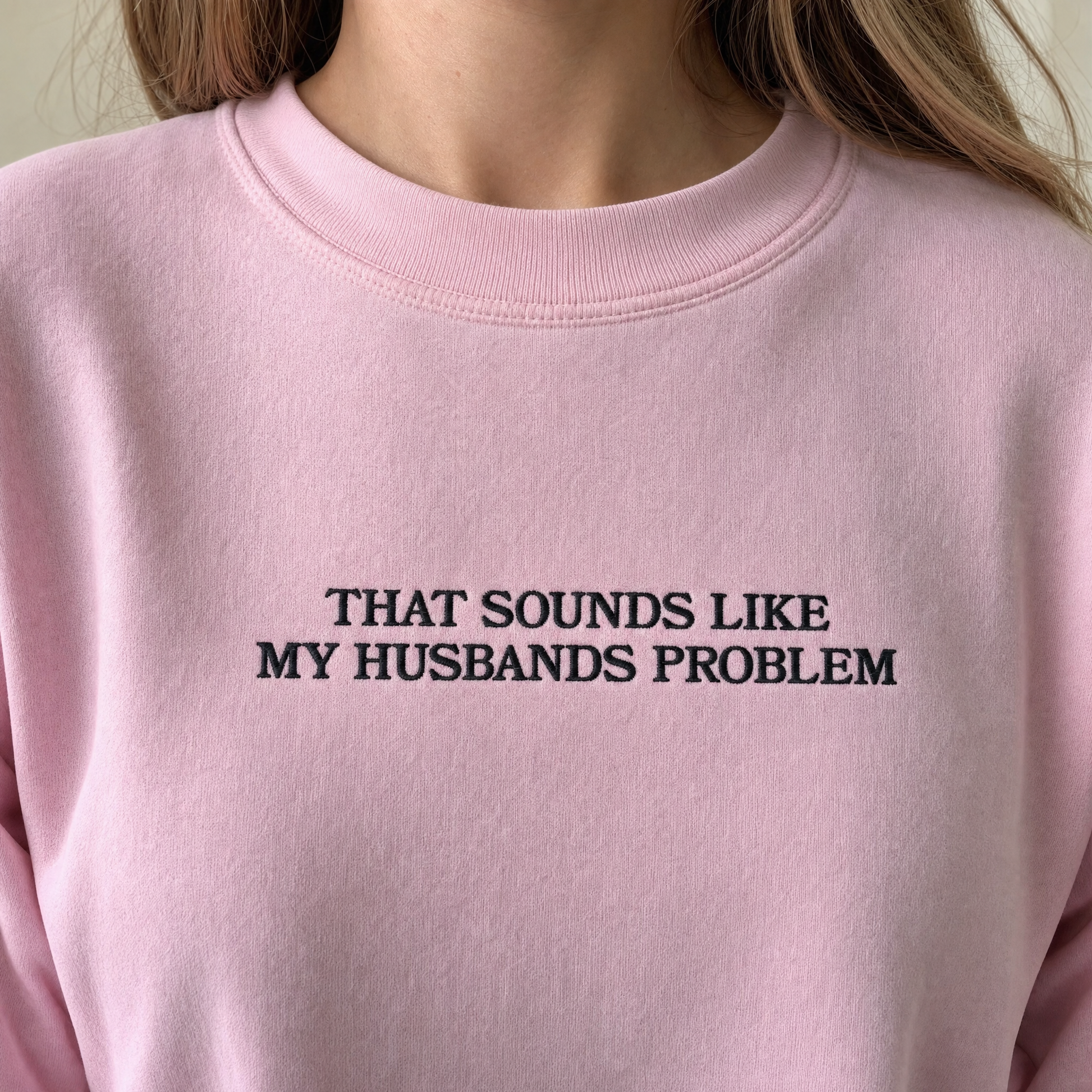 Model wearing the That Sounds Like My Husbands Problem sweatshirt in Light Pink, lifestyle image 2