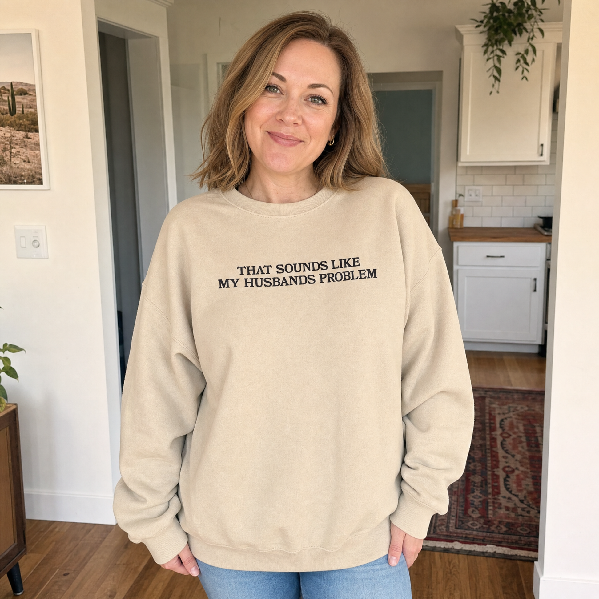 Model wearing the That Sounds Like My Husbands Problem sweatshirt in Sand, lifestyle image 1