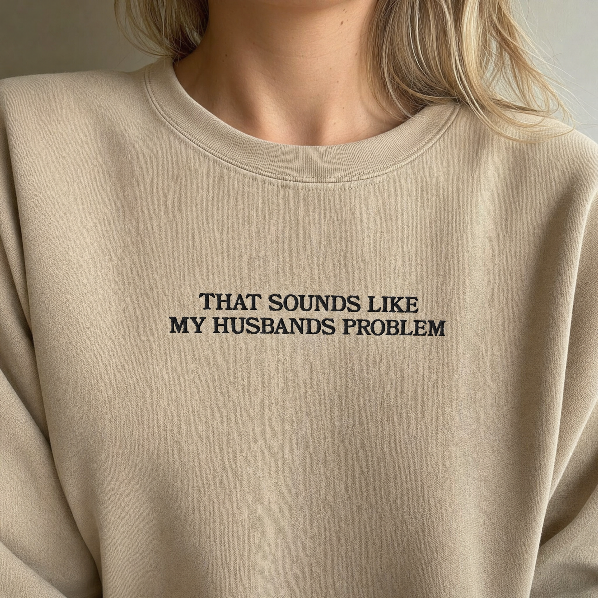 Model wearing the That Sounds Like My Husbands Problem sweatshirt in Sand, lifestyle image 2