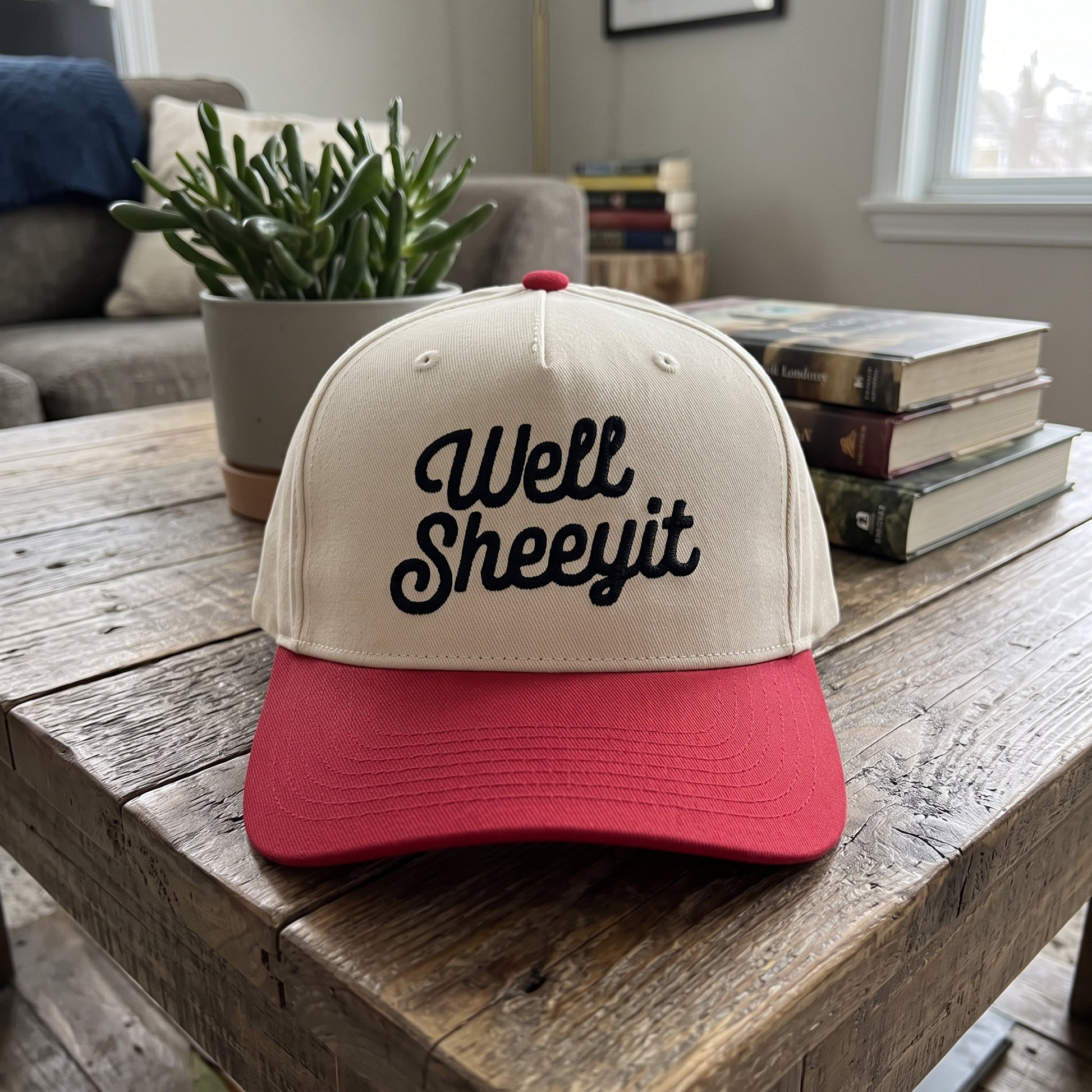 Well Sheeyit Southern Accent embroidered hat in Red/natural resting on a flat surface