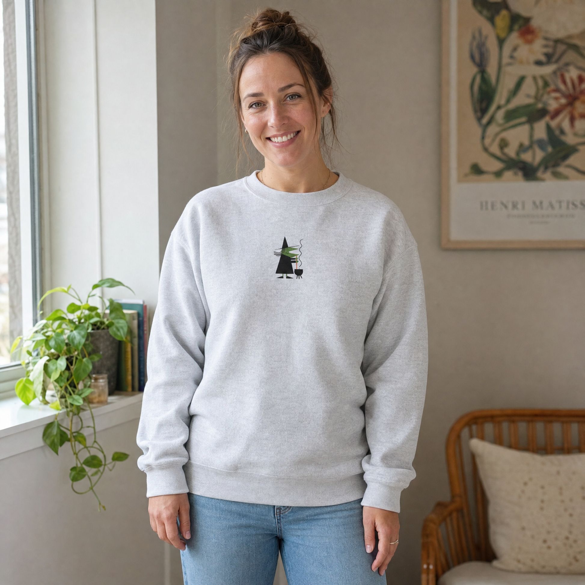 Model wearing the Witch Stirring Cauldron sweatshirt in Ash, cover image 1