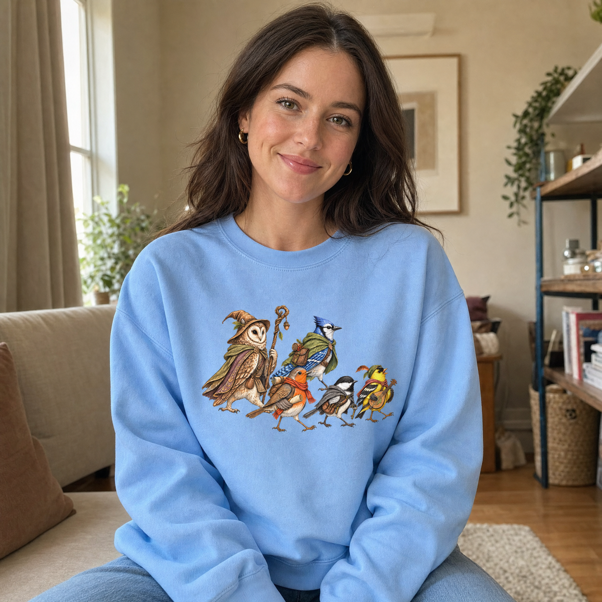 Model wearing the Fantasy Bird Adventurers sweatshirt in Carolina Blue