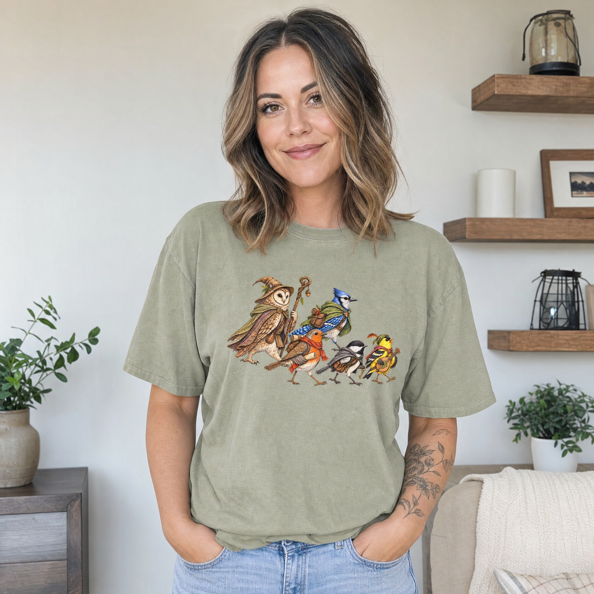 Model wearing the Fantasy Bird Adventurers comfort colors tee in Khaki
