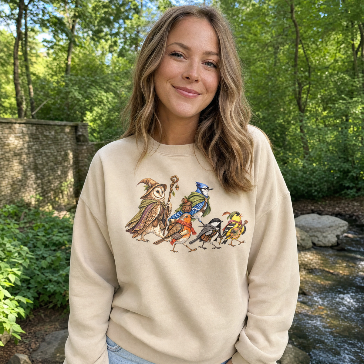 Model wearing the Fantasy Bird Adventurers sweatshirt in Sand, lifestyle image 1