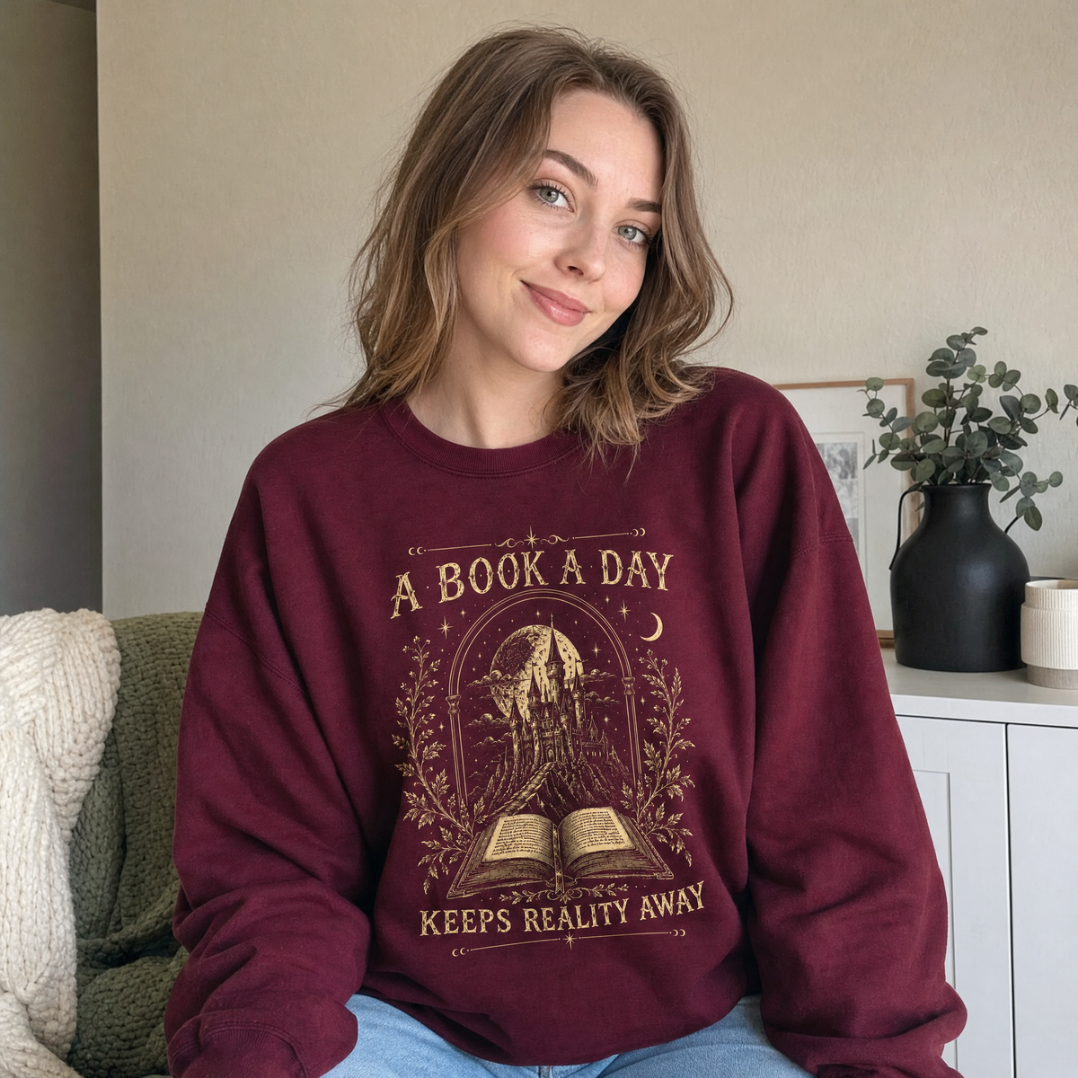 Model wearing the Fantasy Castle Book sweatshirt in Maroon