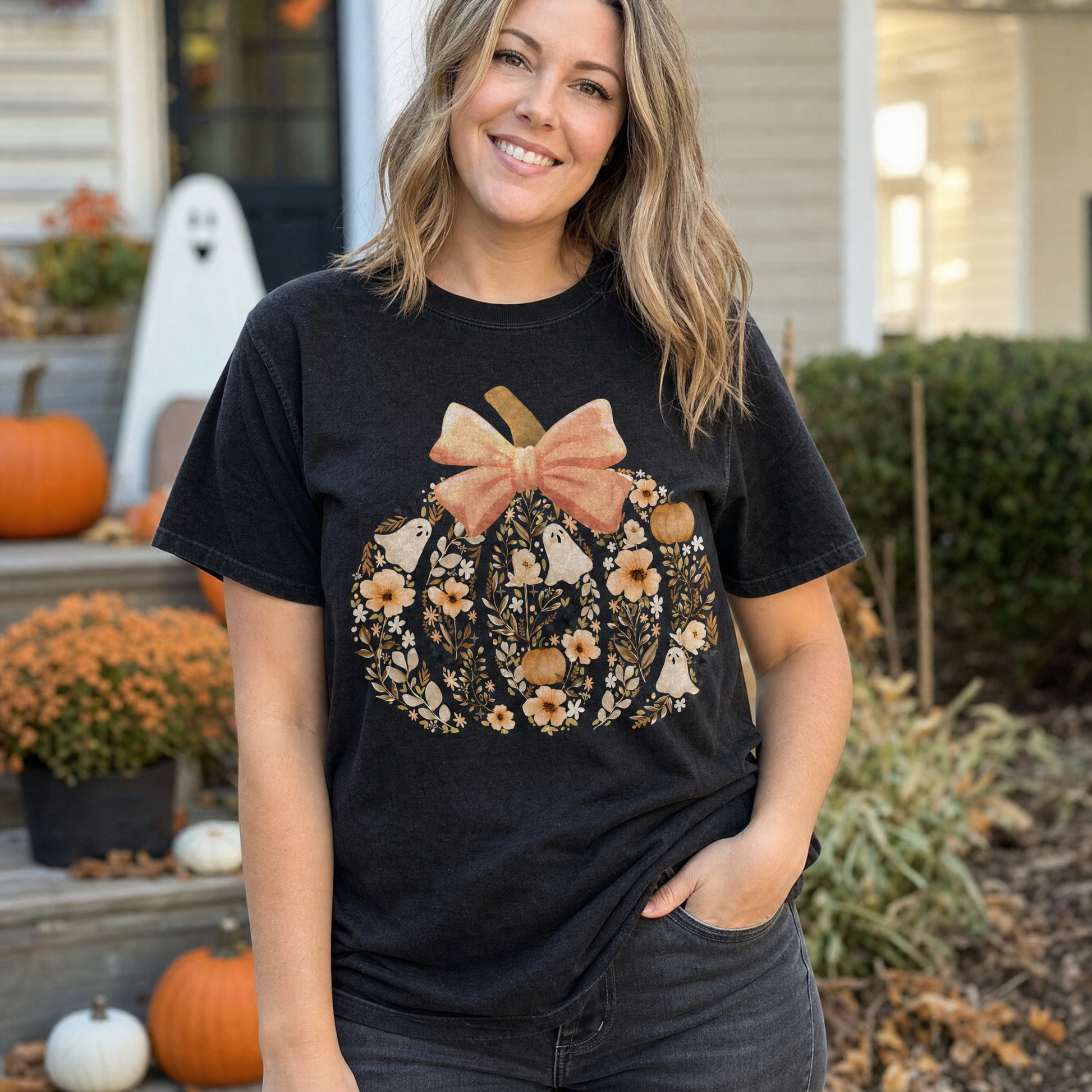 Model wearing the Floral Pumpkin comfort colors tee in Black