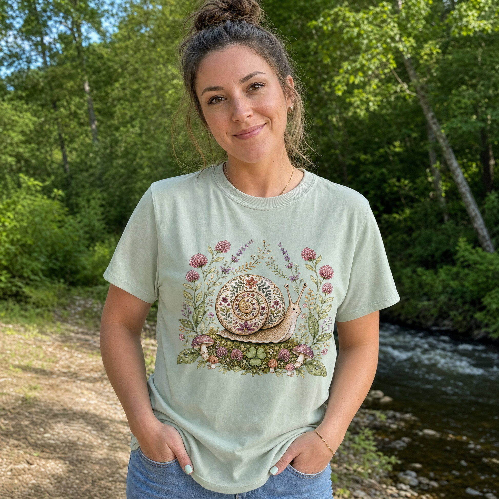 Model wearing the Floral Snail comfort colors tee in Bay