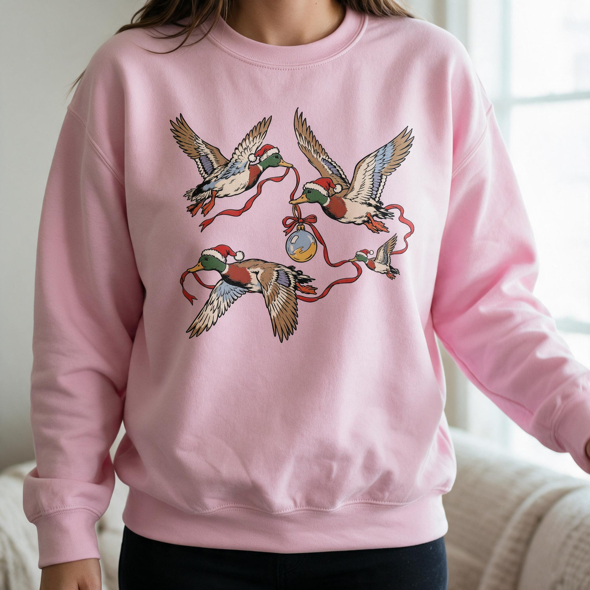 Model wearing the Flying Mallard Ducks sweatshirt in Light Pink