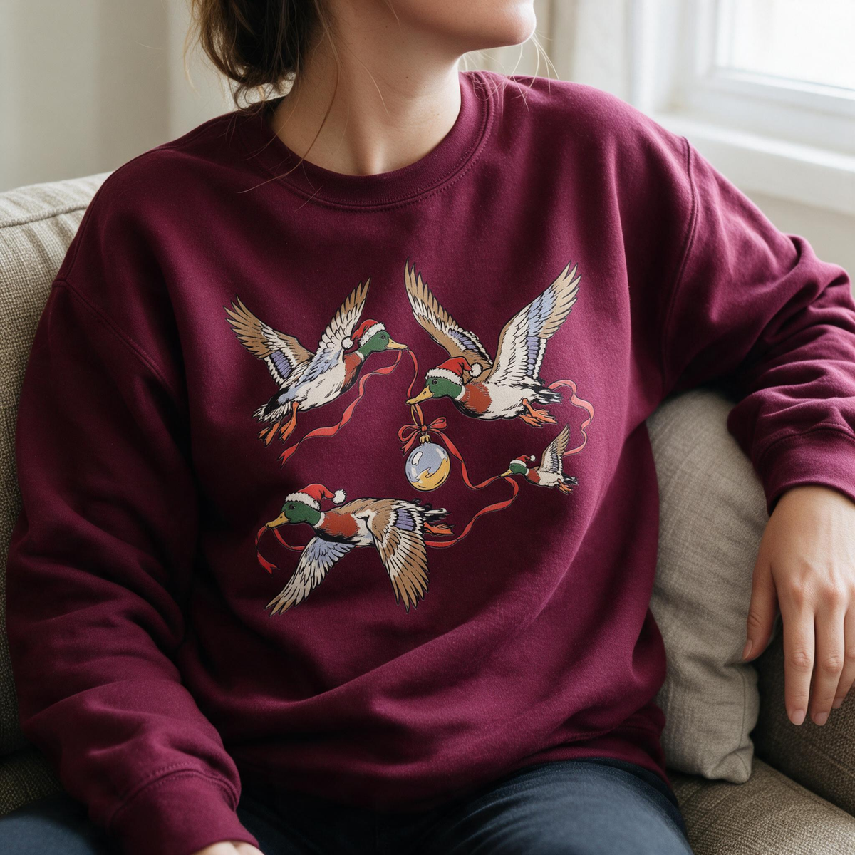Model wearing the Flying Mallard Ducks sweatshirt in Maroon