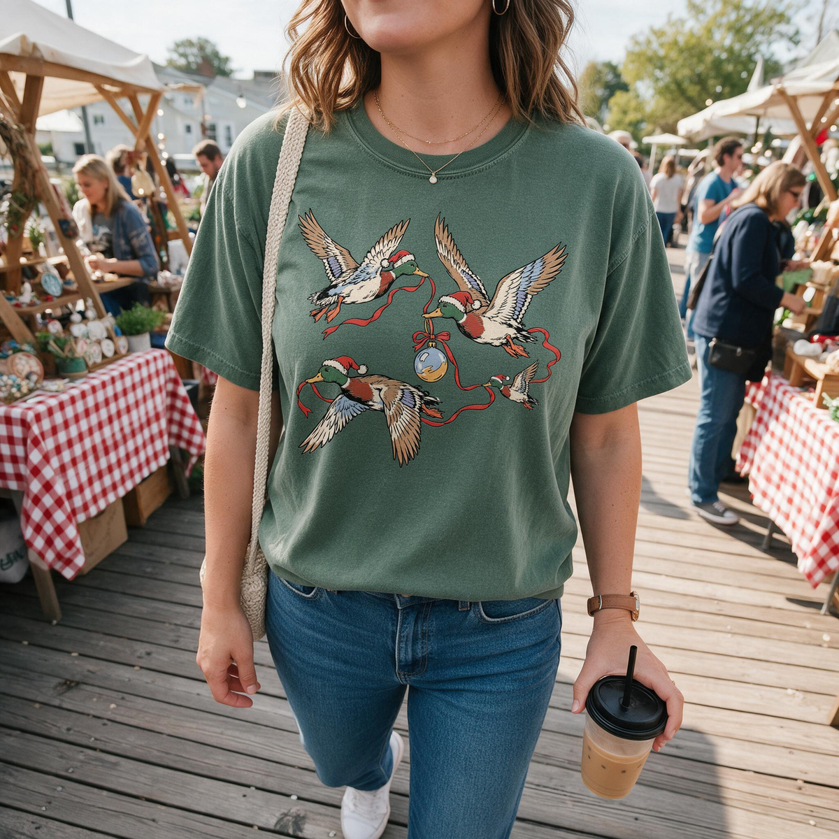 Model wearing the Flying Mallard Ducks comfort colors tee in Moss