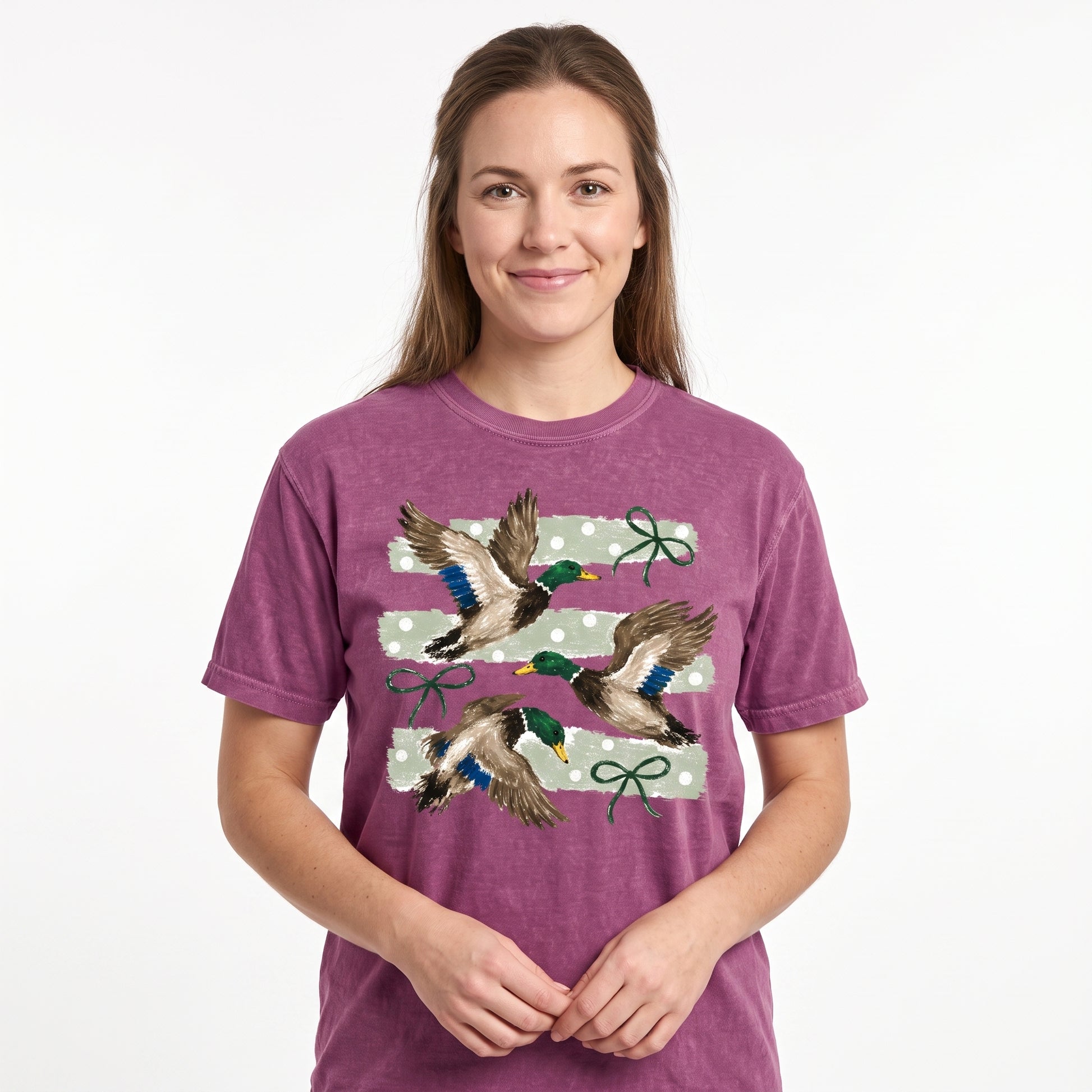 Model wearing the Flying Mallard Ducks comfort colors tee in Berry, cover image 1