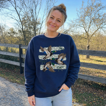 Model wearing the Flying Mallard Ducks sweatshirt in Navy