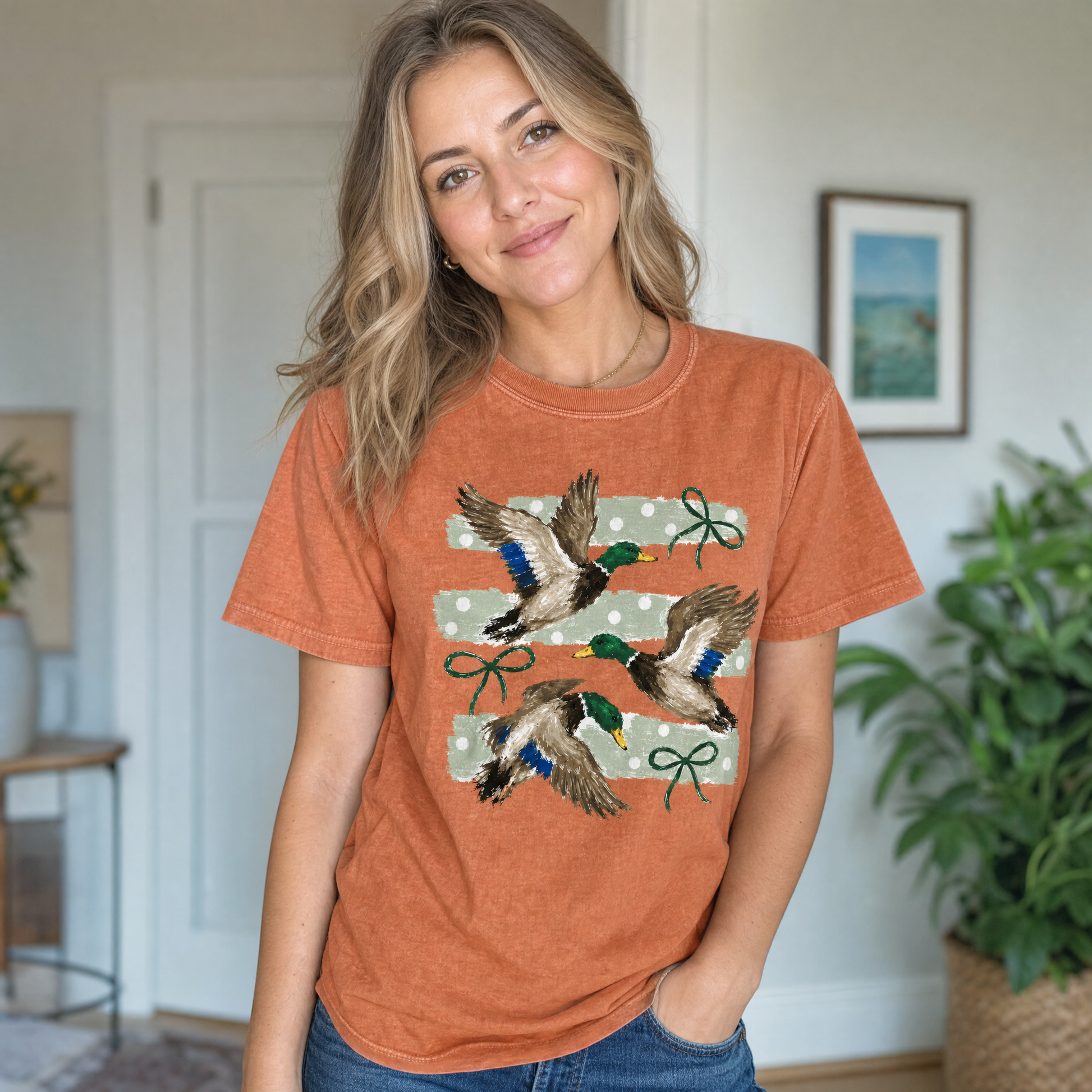 Model wearing the Flying Mallard Ducks comfort colors tee in Yam