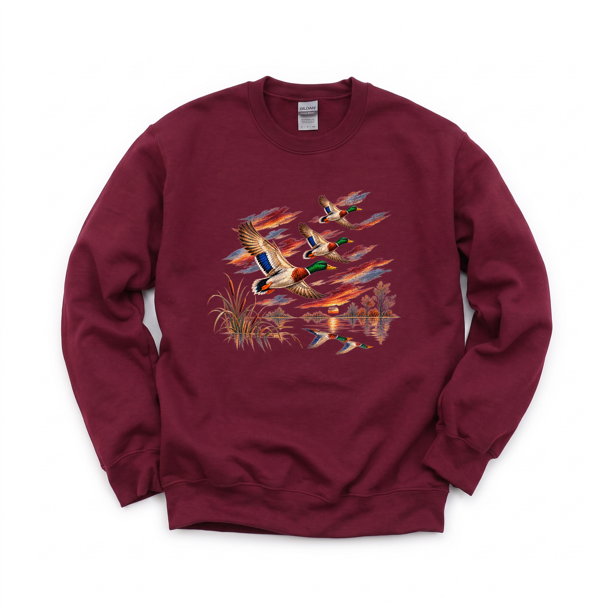Flying Mallard Ducks graphic on Gildan 18000 in Maroon