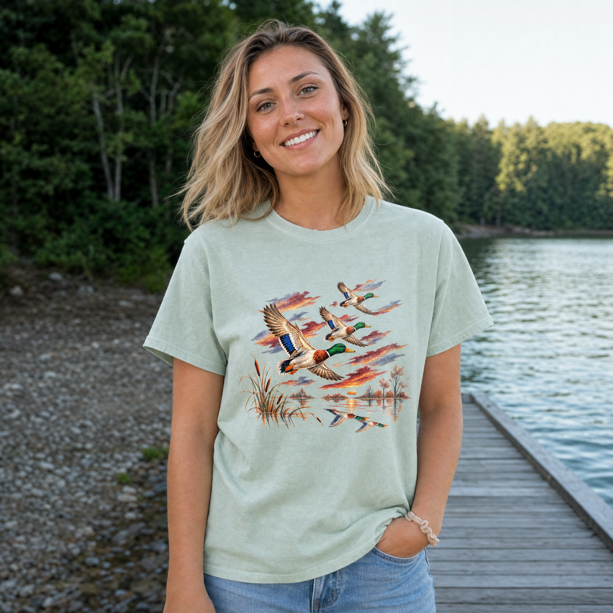 Model wearing the Flying Mallard Ducks comfort colors tee in Bay