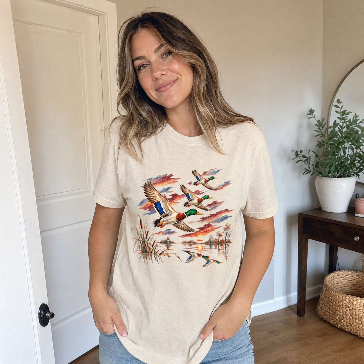Model wearing the Flying Mallard Ducks comfort colors tee in Ivory