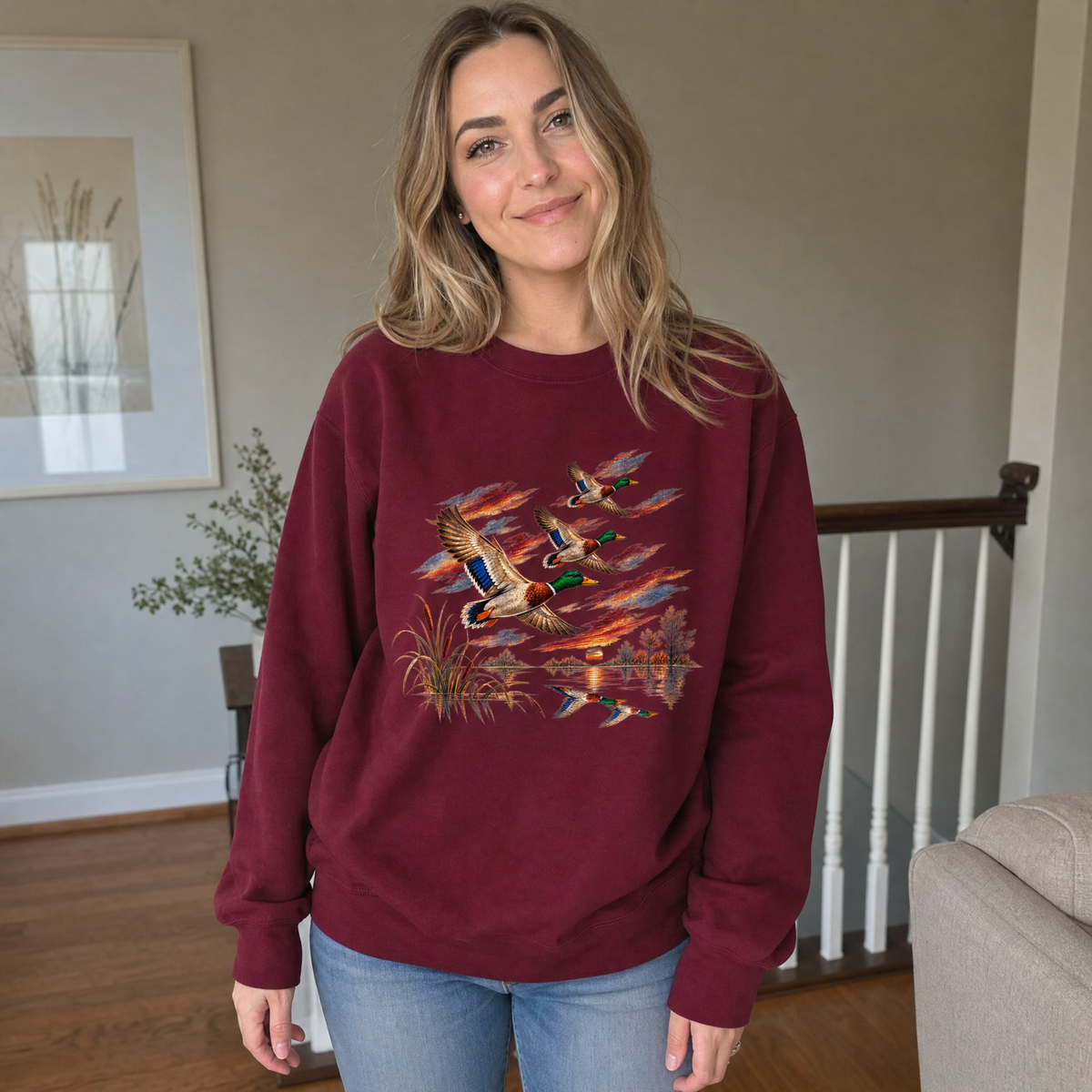 Model wearing the Flying Mallard Ducks sweatshirt in Maroon