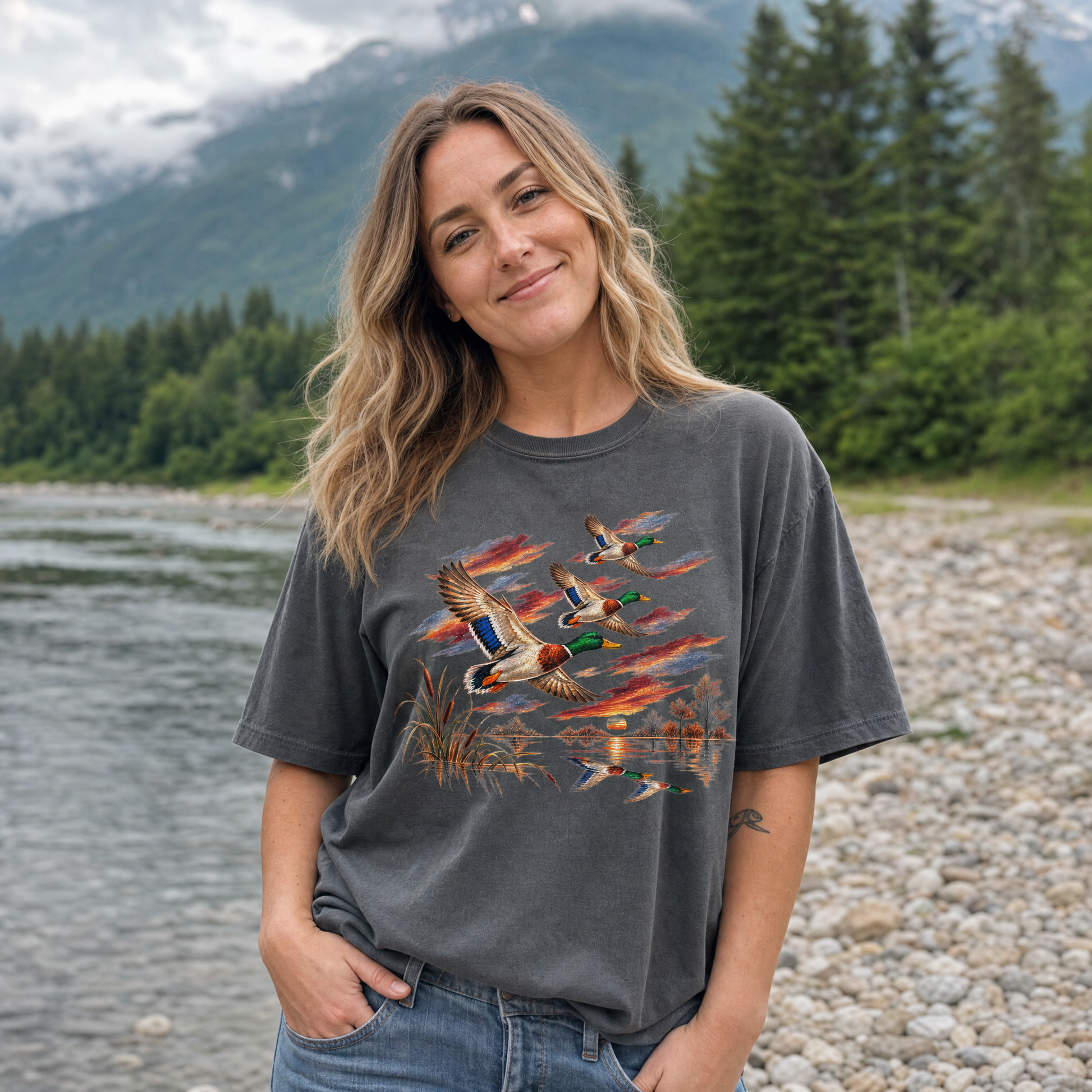 Model wearing the Flying Mallard Ducks comfort colors tee in Pepper