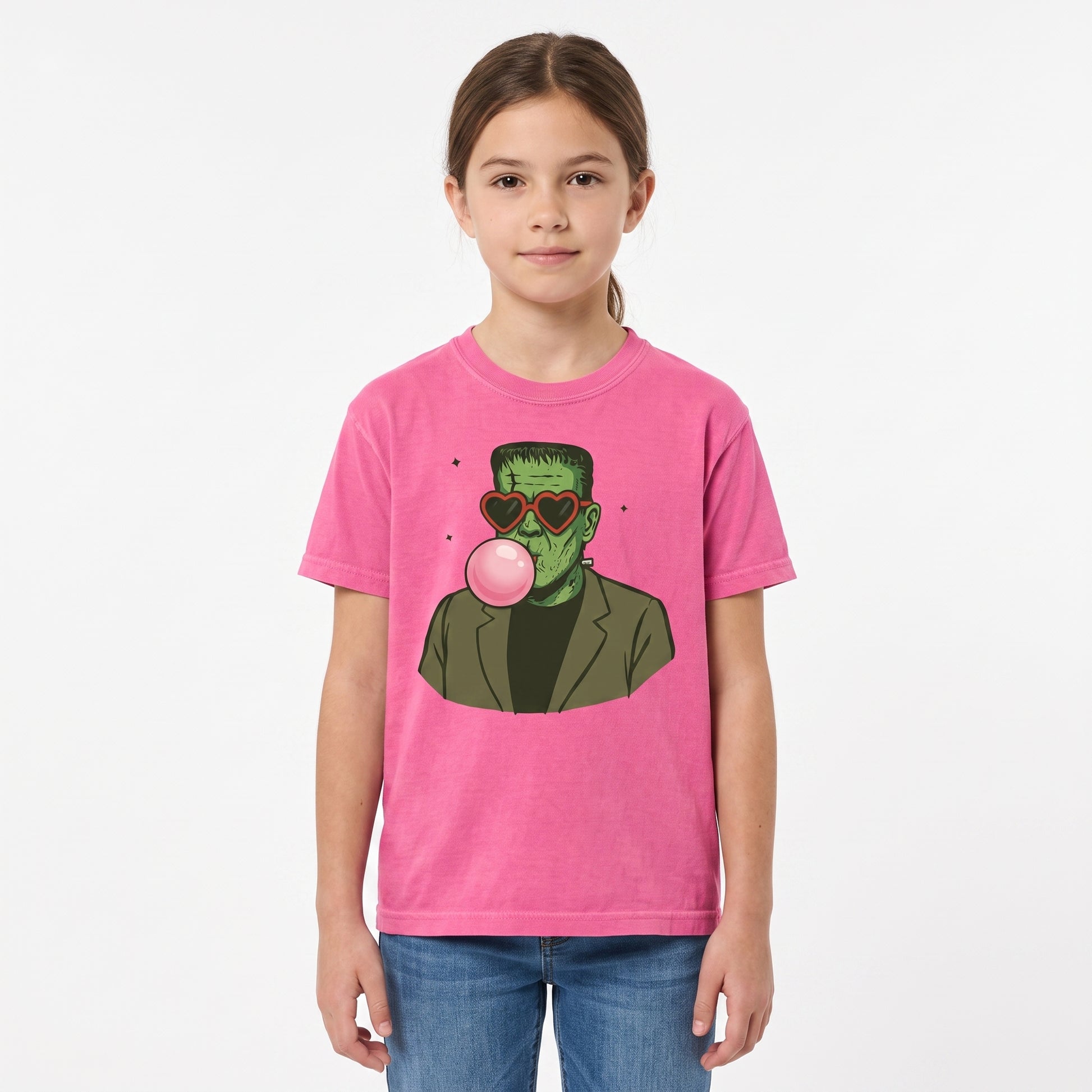 Model wearing the Frankenstein Monster youth comfort colors tee in Crunchberry, cover image 1