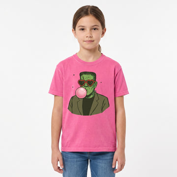 Model wearing the Frankenstein Monster youth comfort colors tee in Crunchberry, cover image 1