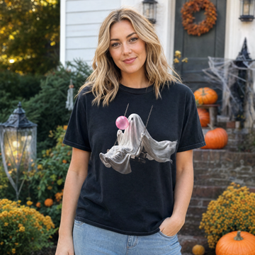 Model wearing the Ghost Blowing Bubblegum comfort colors tee in Black, lifestyle image 1