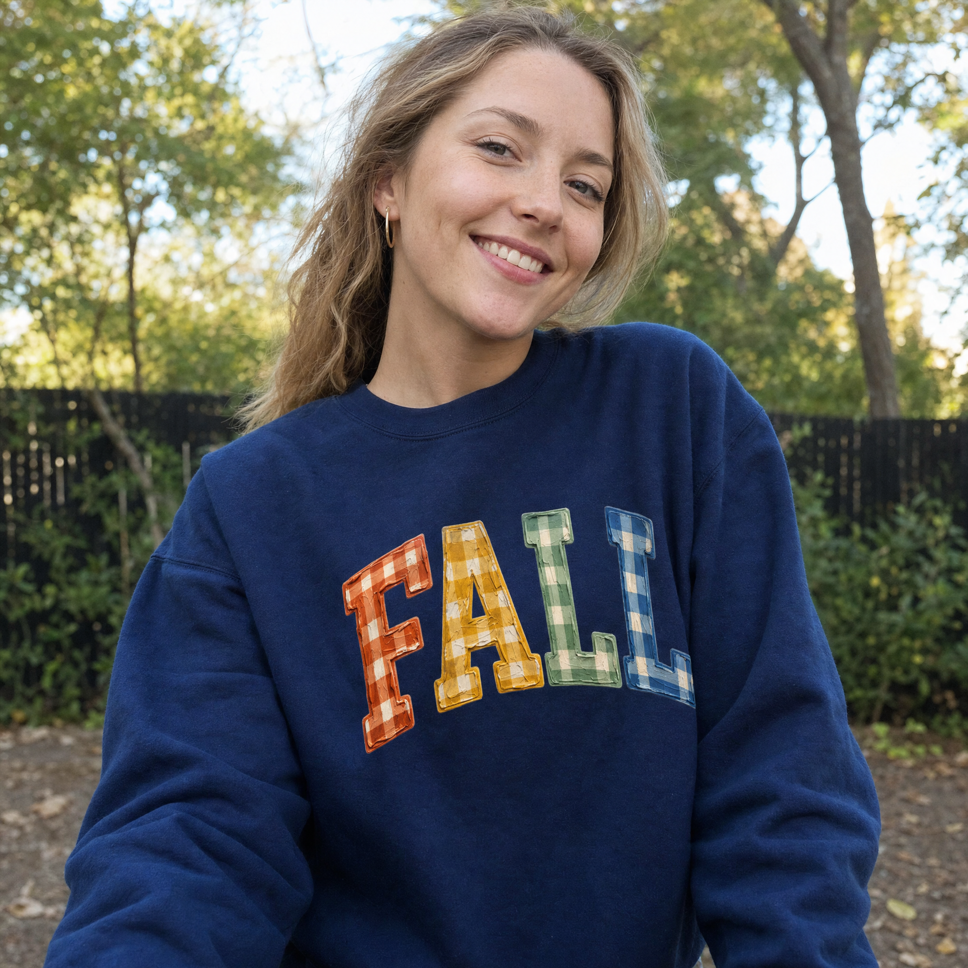 Model wearing the Gingham Fall Letters sweatshirt in Navy