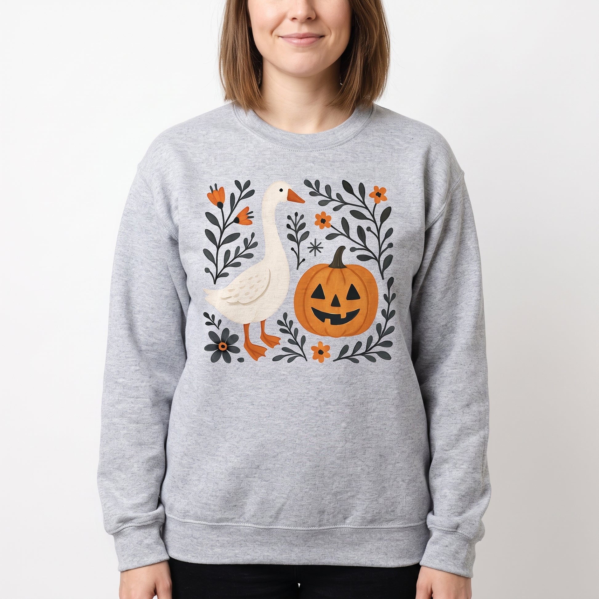 Model wearing the Goose Jack-o'-lantern sweatshirt in Sport Grey, cover image 1