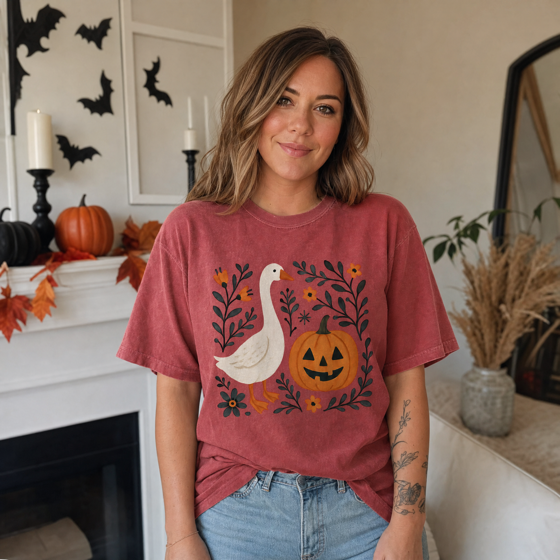 Model wearing the Goose Jack-o'-lantern comfort colors tee in Brick