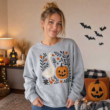 Model wearing the Goose Jack-o'-lantern sweatshirt in Sport Grey, lifestyle image 1