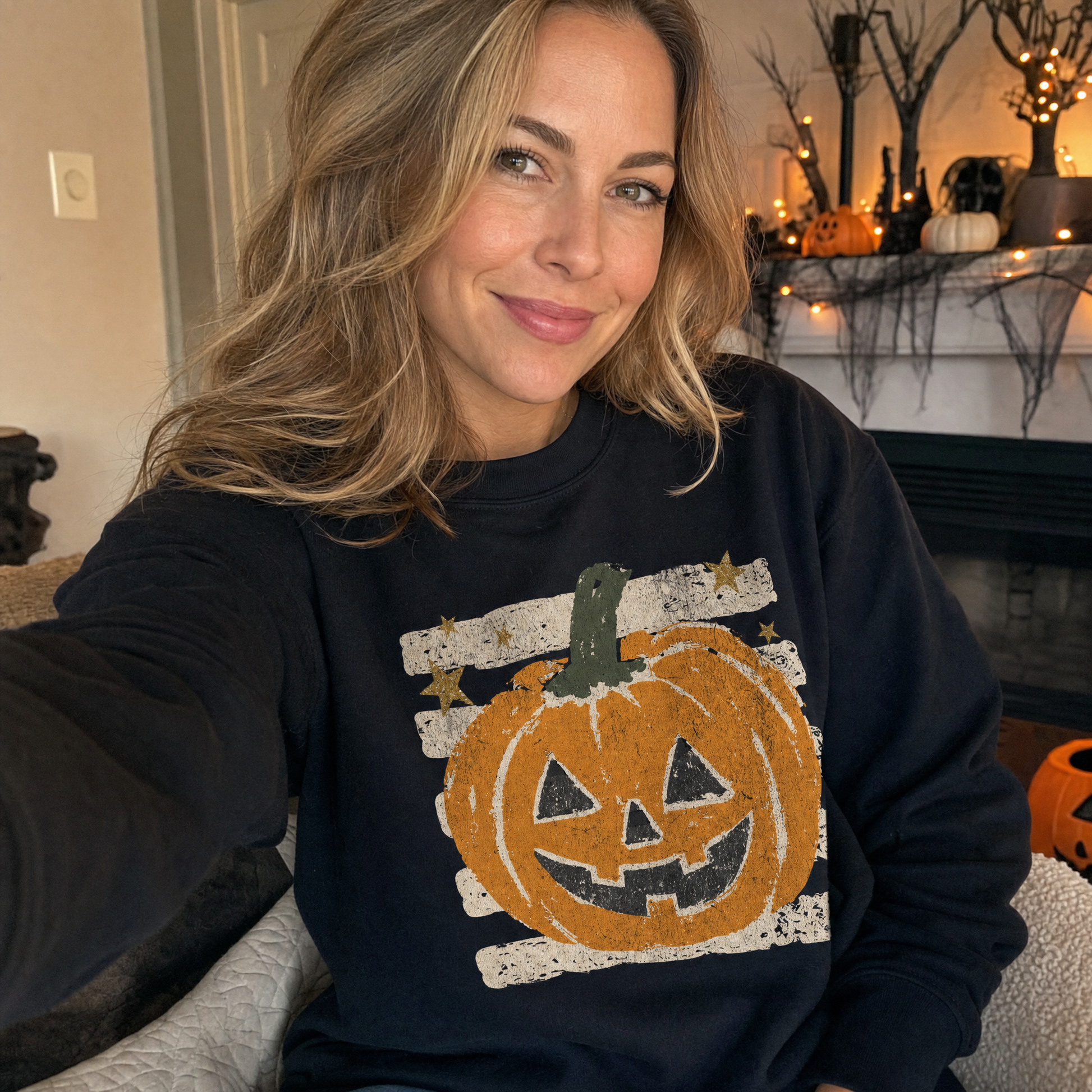 Model wearing the Grungy Jack-o'-lantern sweatshirt in Black