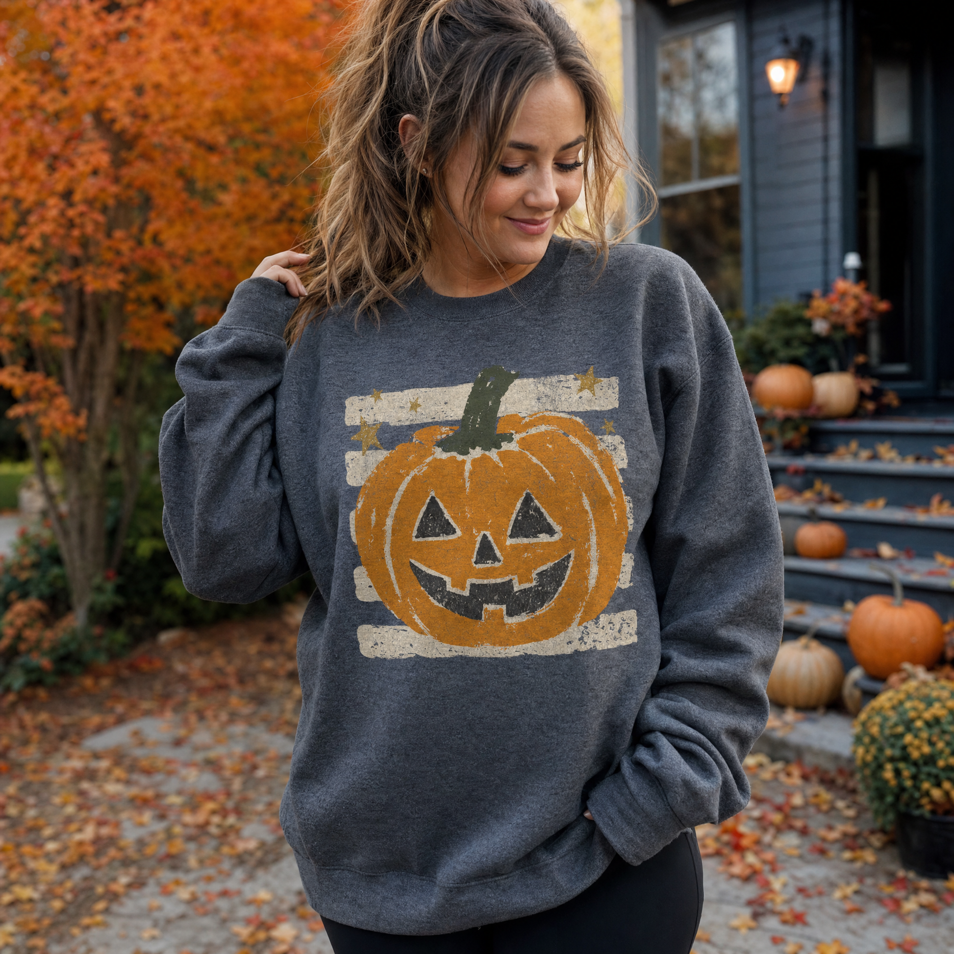 Model wearing the Grungy Jack-o'-lantern sweatshirt in Dark Heather