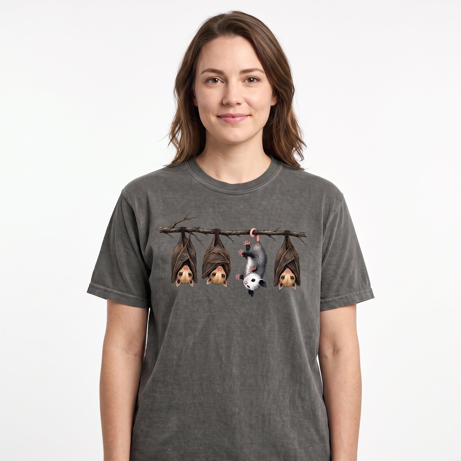 Model wearing the Hanging Bats comfort colors tee in Pepper, cover image 1