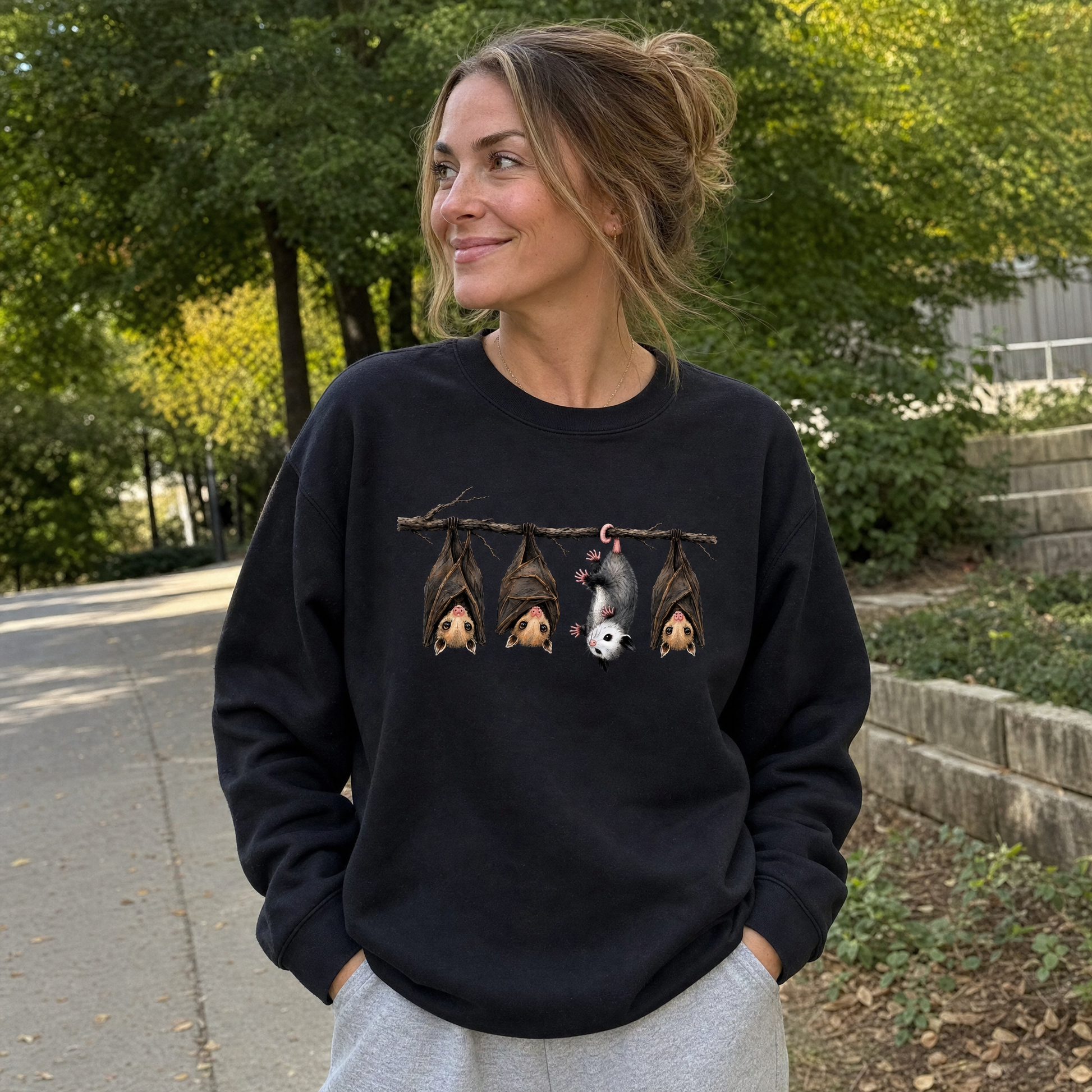 Model wearing the Hanging Bats sweatshirt in Black