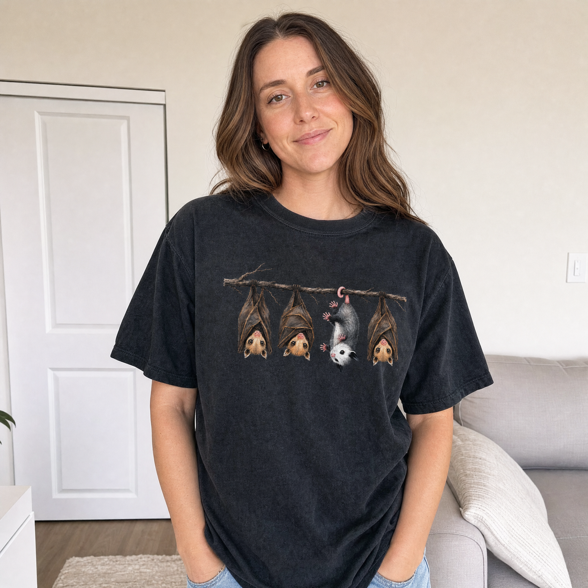 Model wearing the Hanging Bats comfort colors tee in Black