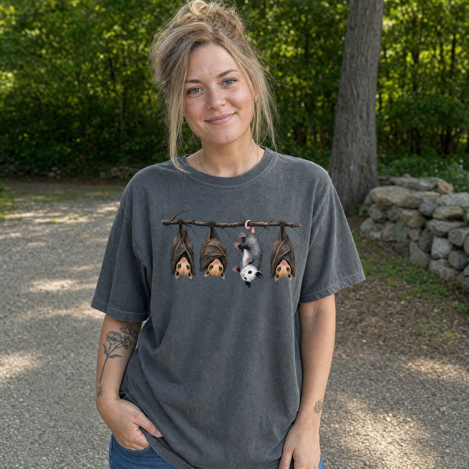 Model wearing the Hanging Bats comfort colors tee in Pepper, lifestyle image 1