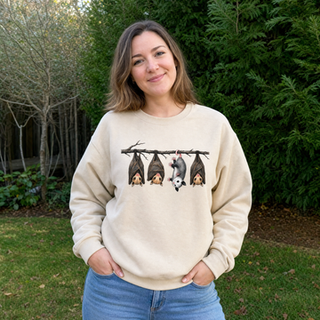 Model wearing the Hanging Bats sweatshirt in Sand, lifestyle image 1