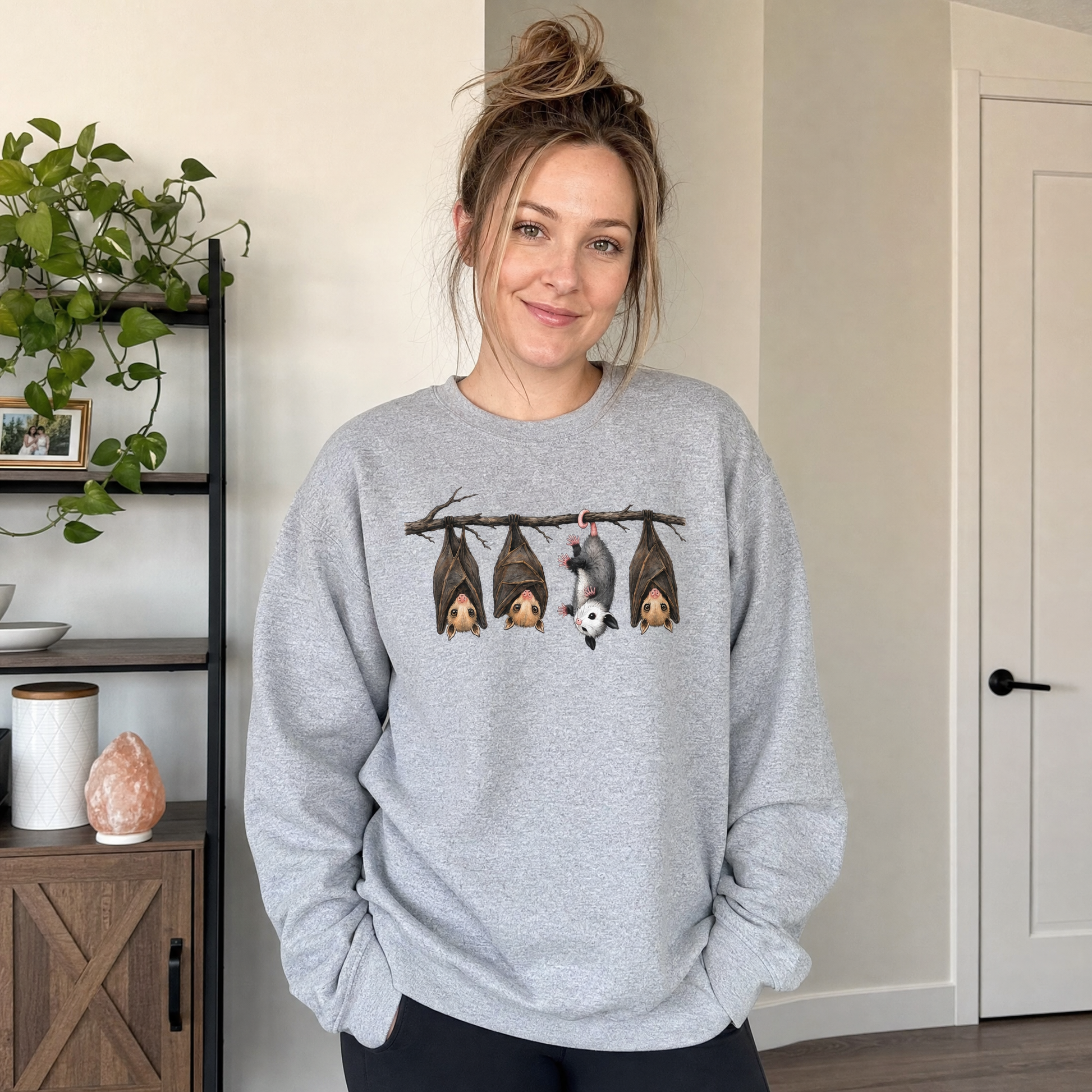 Model wearing the Hanging Bats sweatshirt in Sport Grey